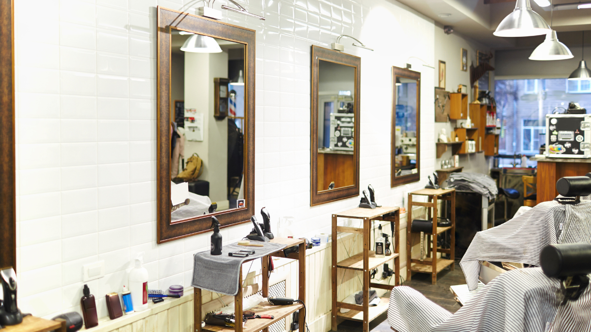 A barbershop space that's multi-purposing furniture is show in this image. 